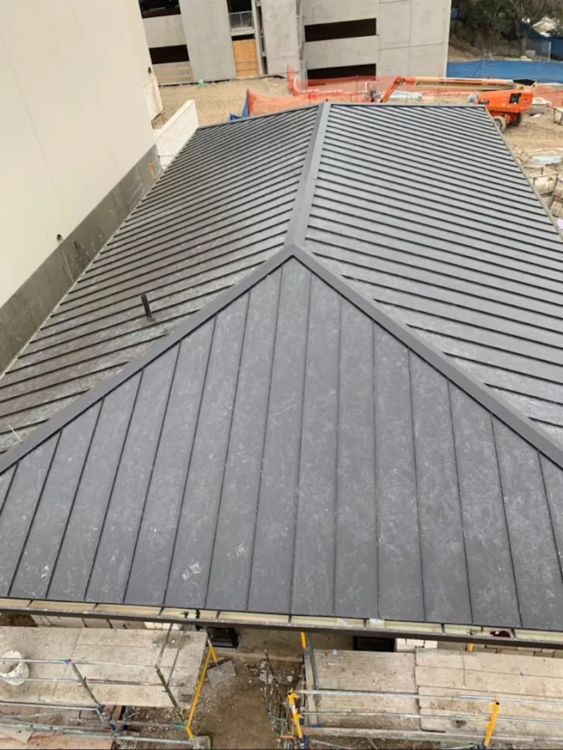 Commercial metal roof construction with crane equipment in Murphysboro