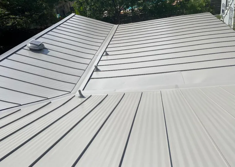 Solar attic fan installed on a metal roof for Roof Ventilation in Murphysboro